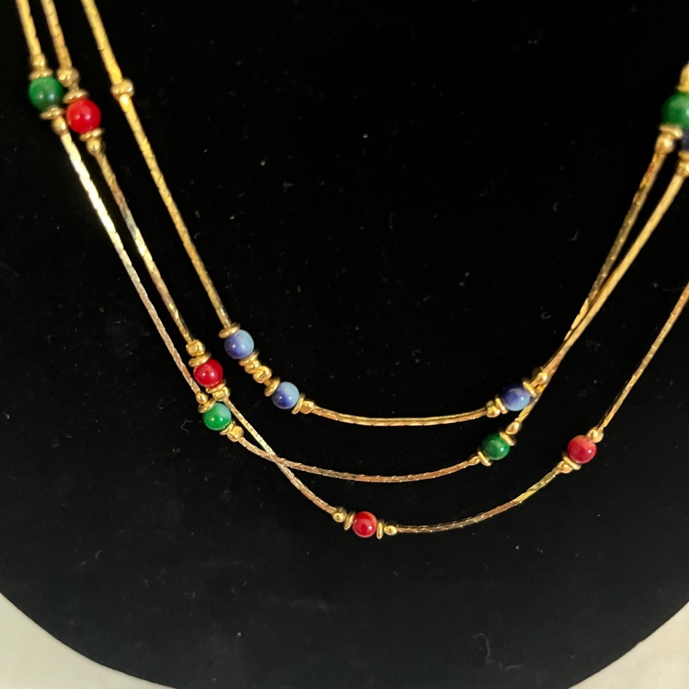 Multi strand gold tone beaded necklace